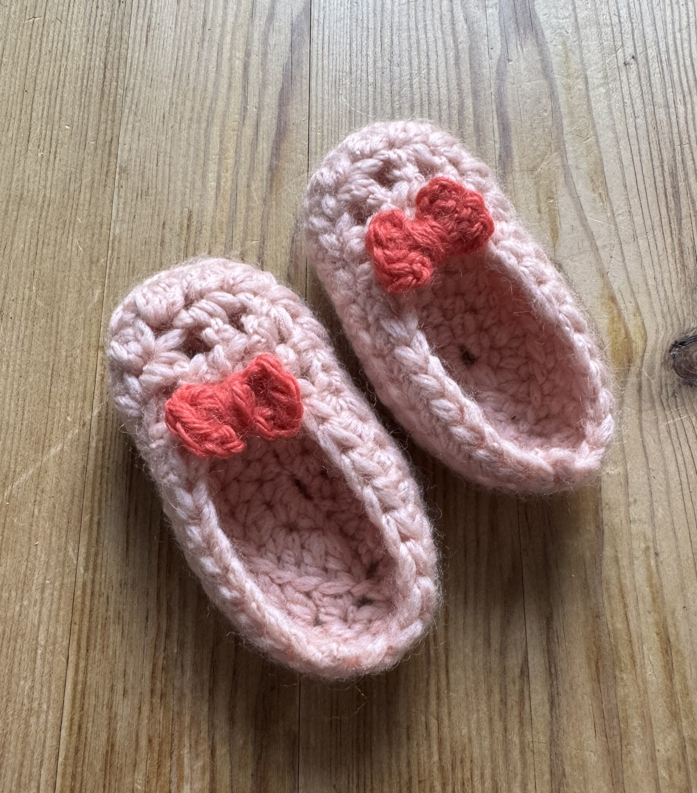 Finished pink baby shoe with bow