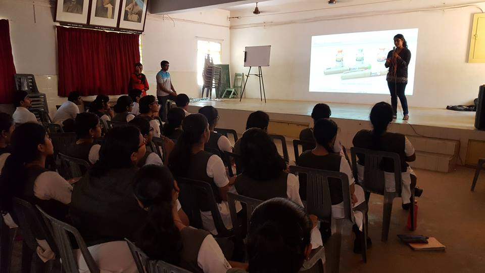 Aiswarya Prasad speaking to an auditorium of highschool students